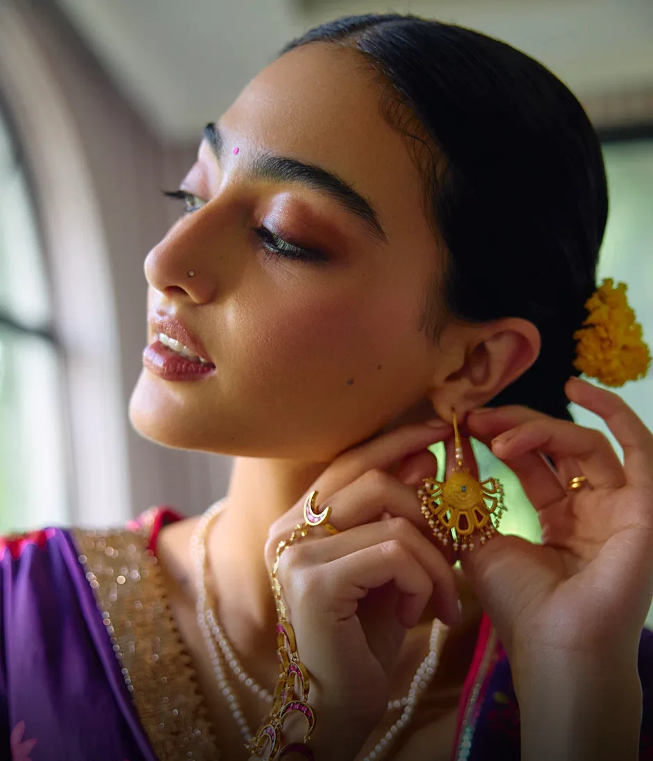 Post: The final flourish.
Gold-toned jewellery to finish a festive look: marigold earrings, a sculpted bangle and pieces for t
